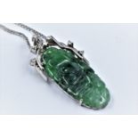 Oriental 9ct white gold diamond and jade pendant on chain, the pendant 38mm