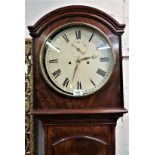 George III mahogany longcase clock, the arched hood above an arched door raised on bracket feet, the