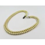 Double row uniform cultured pearl necklace with 9ct gold clasp, 44cms