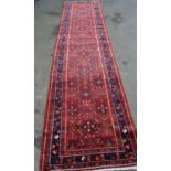 Modern Hamadan runner with an all-over Herati design on a red ground with borders, 13ft x 3ft
