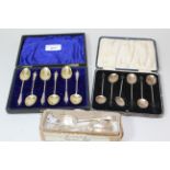 Cased set of six Birmingham silver apostle handled coffee spoons, another cased set of silver bean