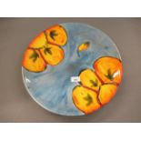 Poole pottery, large circular wall charger of floral design, 15.75ins diameter