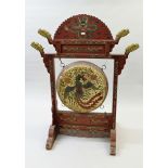 Large Tibetan red lacquered temple drum on stand carved with dragon heads and all-over painted