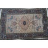 Kashmiri part silk rug with a lobed medallion and all-over floral design on an ivory ground with