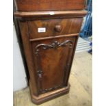 Victorian mahogany bedside cabient with a single drawer above a door, with applied mouldings on a