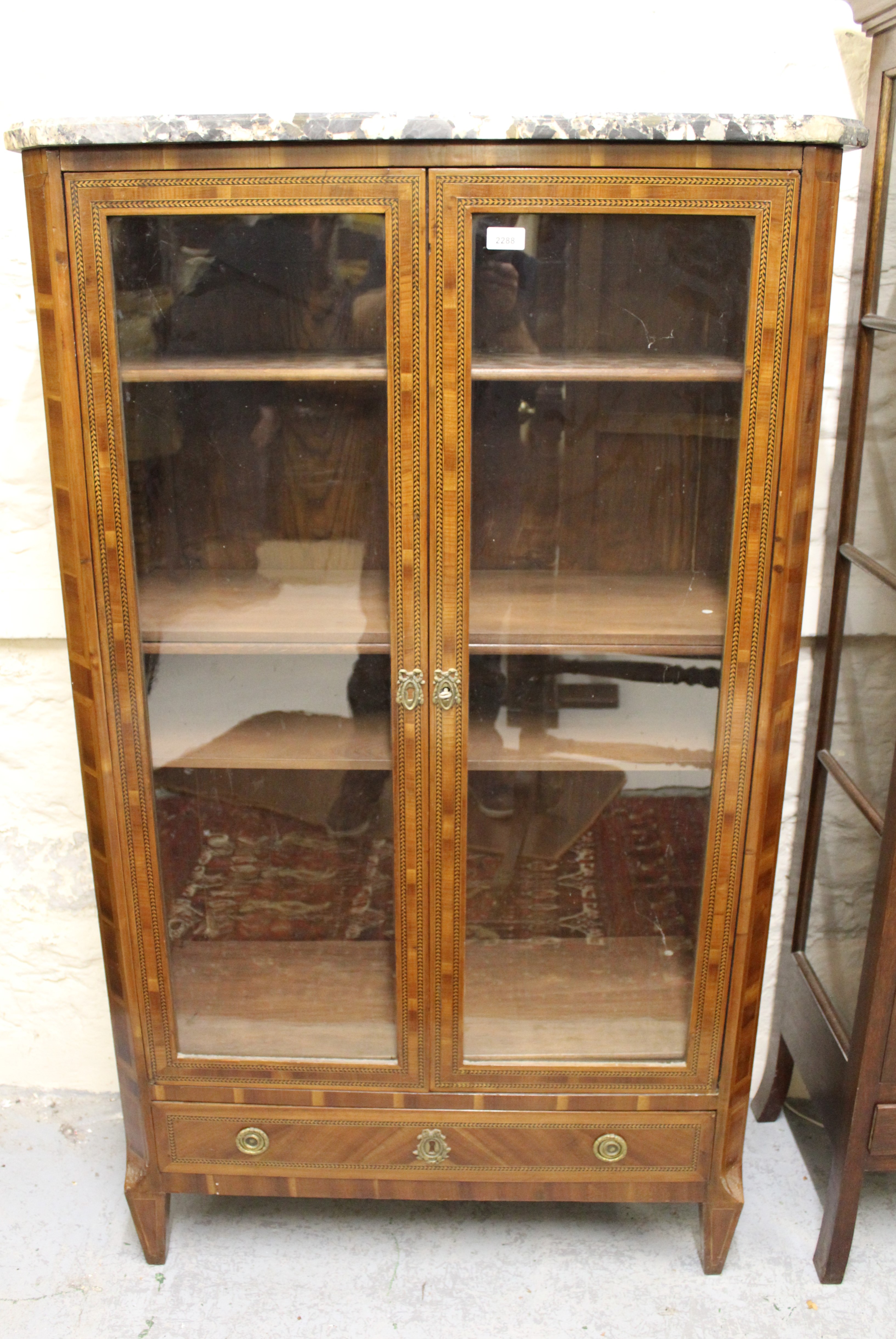 19th Century French walnut & inlaid vitrine, the marble top above two glazed doors enclosing