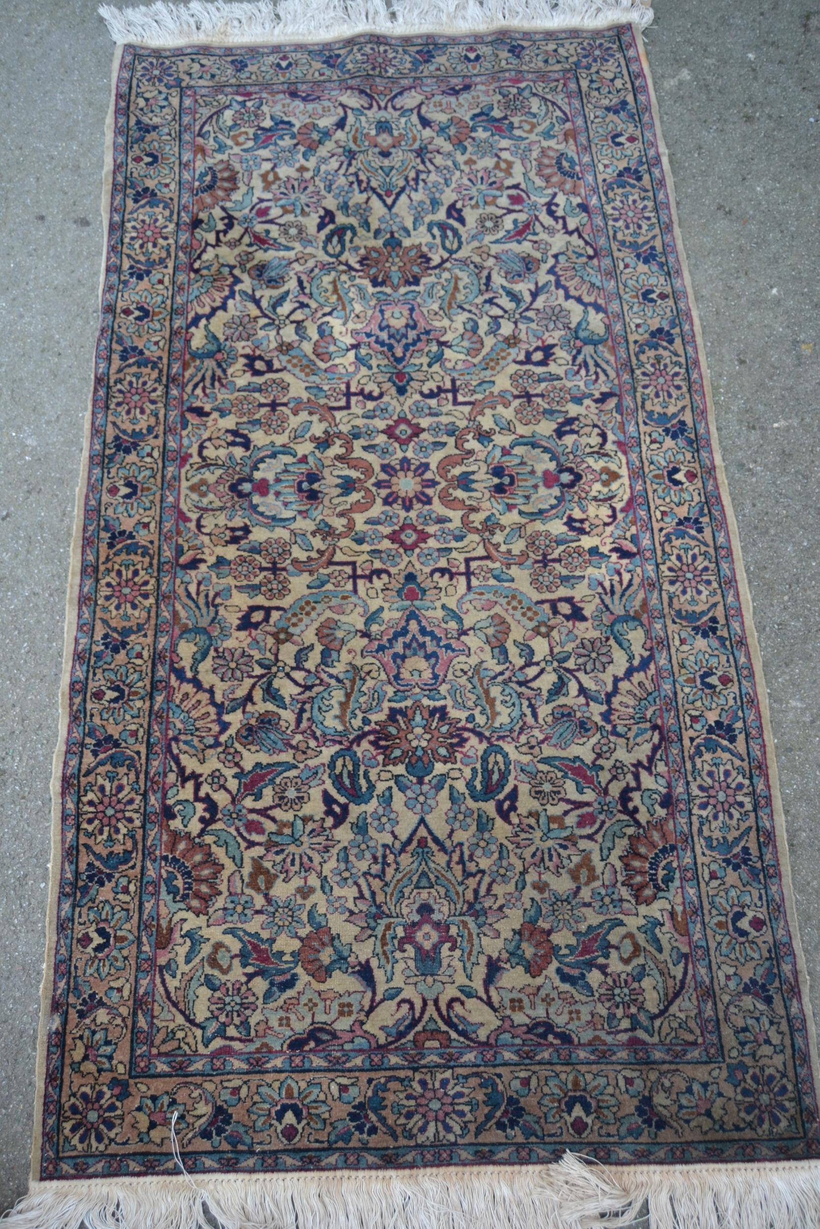 Small Indo Persian rug with an all-over floral design on a ivory ground with borders, 5ft 5ins x 2ft