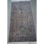 Small Indo Persian rug with an all-over floral design on a ivory ground with borders, 5ft 5ins x 2ft