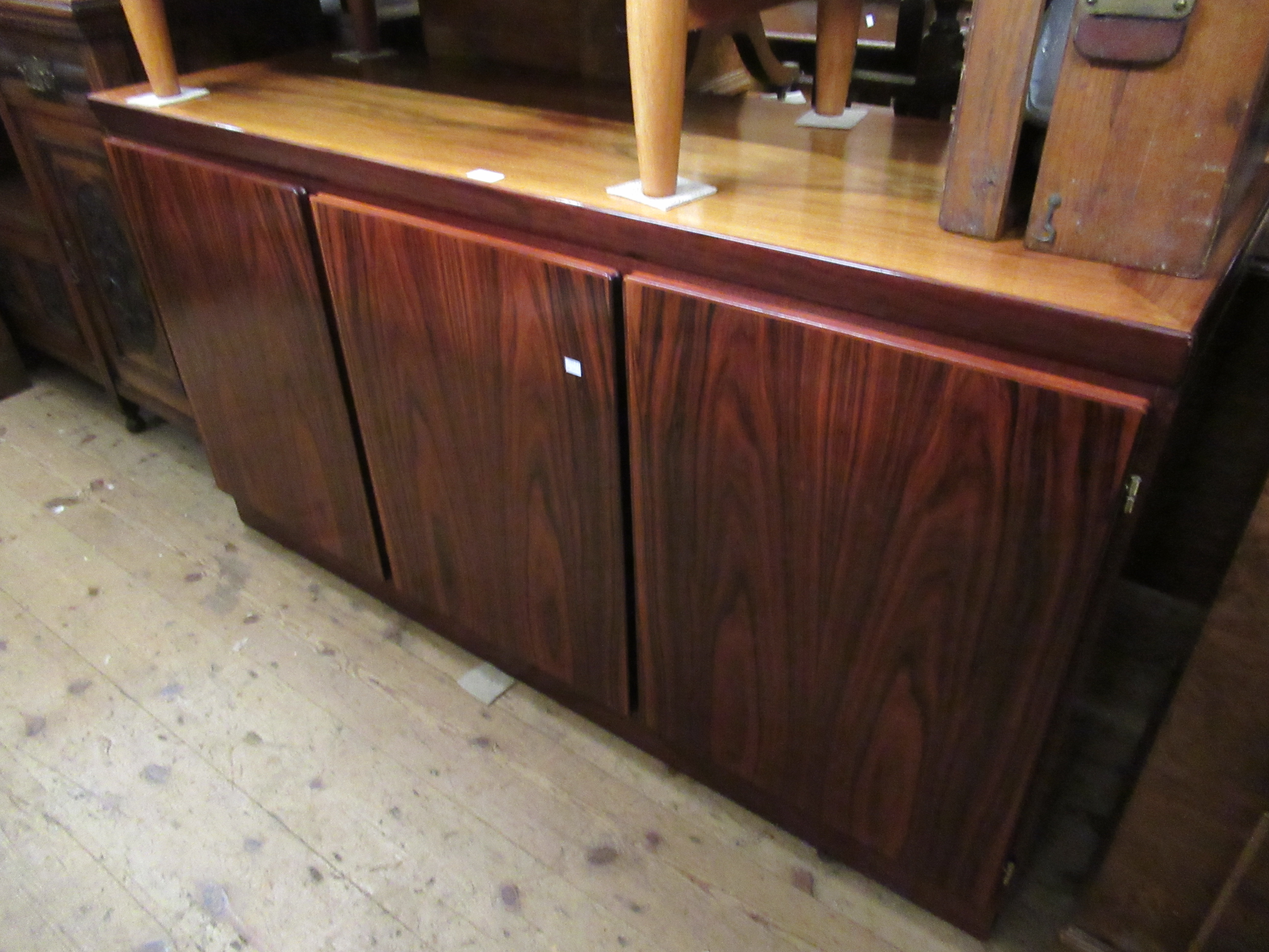 Mid 20th Century three door sideboard by Skovby, Denmark, three plain doors enclosing shelves and