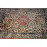 Tabriz rug with a medallion and all-over floral design on an ivory ground with blue ground rosette
