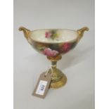 Royal Worcester boat shaped two handled pedestal vase, painted with roses on a gilt and enamel base,