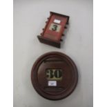 Early 20th Century circular mahogany wall mounted calendar, together with a similar table calendar