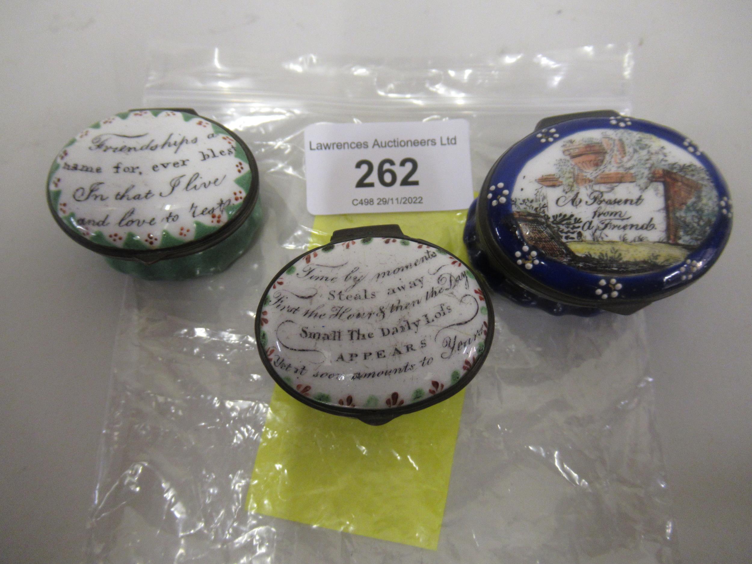 Group of three 18th Century Battersea/Bilston type enamel patch boxes, with motto lids, the