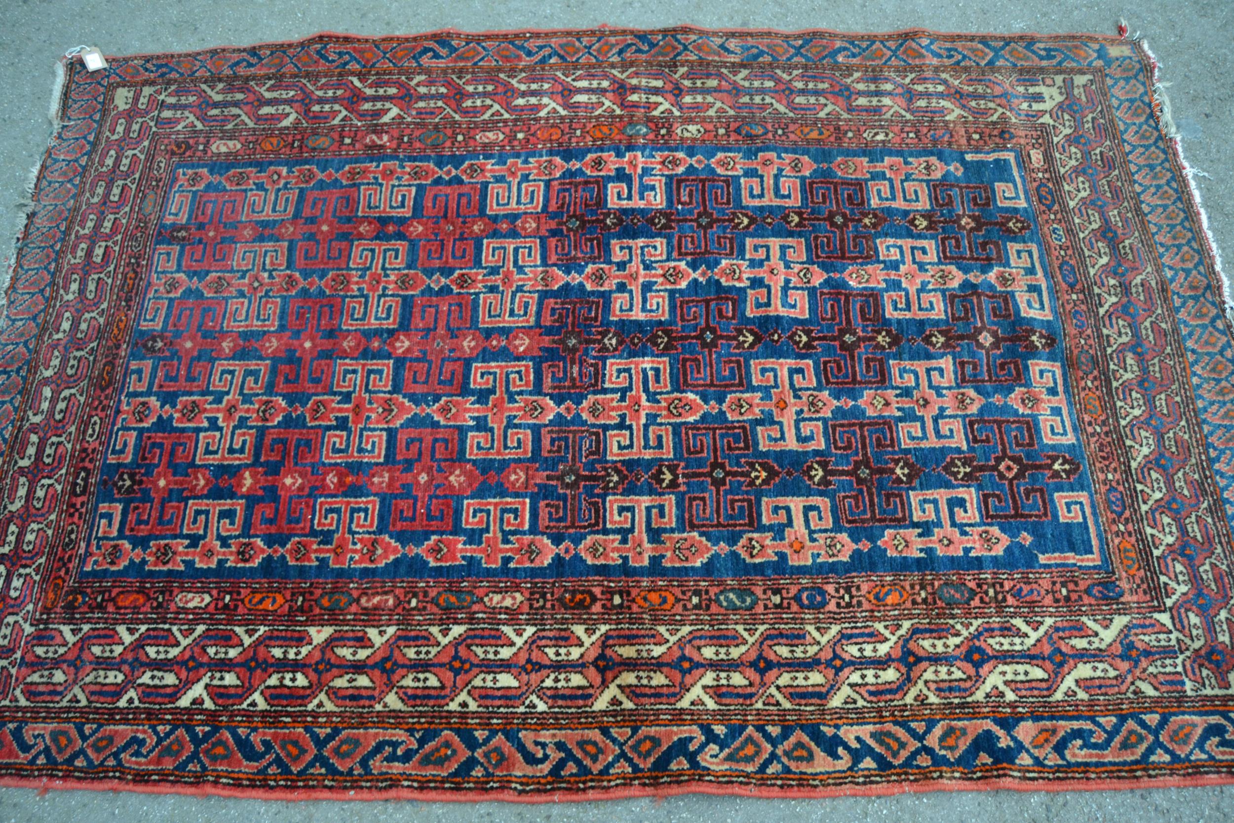 Kurdish rug with an all-over hooked medallion design on a deep blue ground with multiple border, 6ft