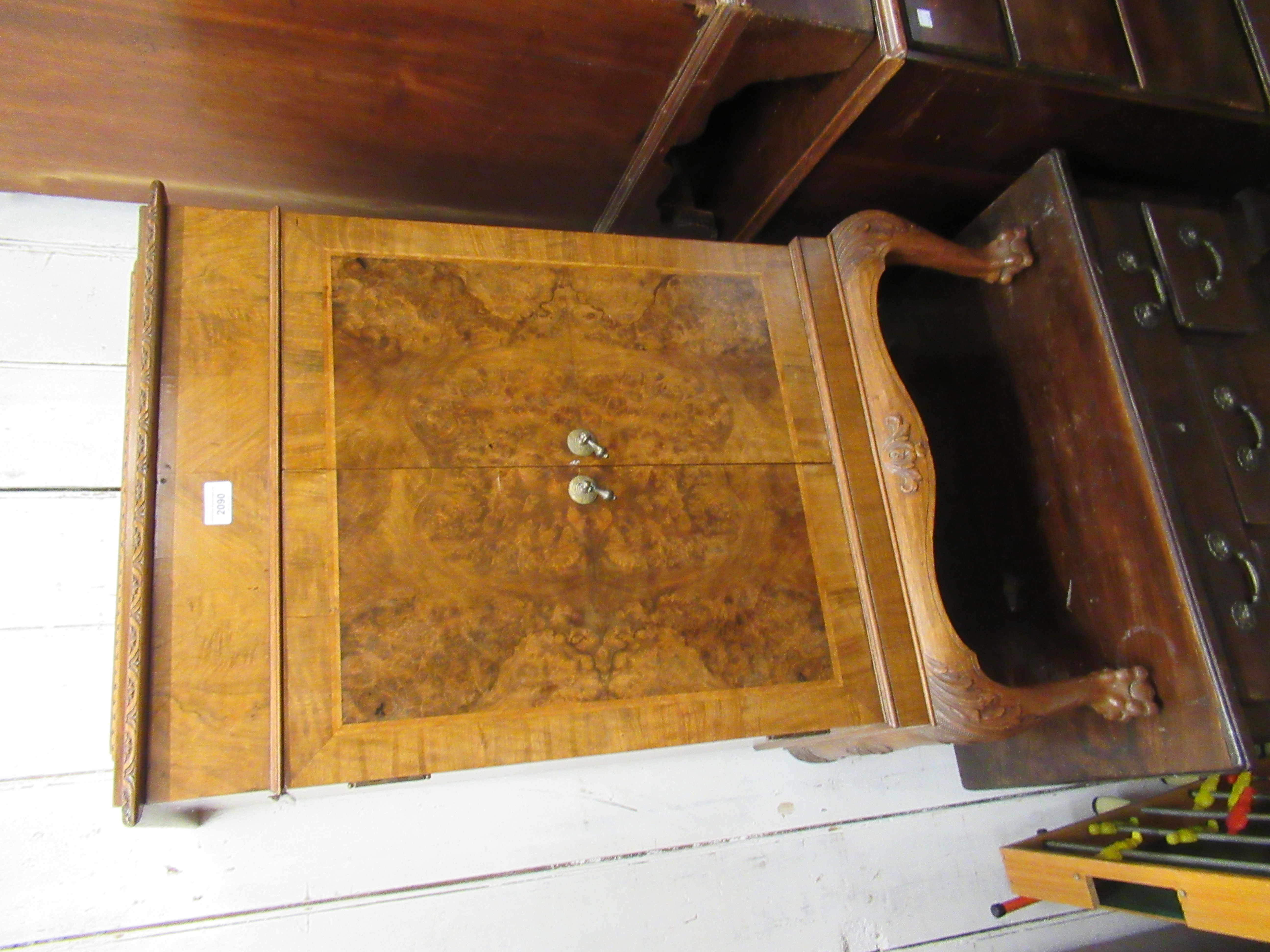 Mid 20th Century figured walnut side cabinet, the carved moulded top above a pair of panel doors