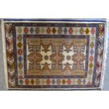 Small Pakistan mat of Turkoman design, together with another similar, smaller