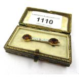 Gold, citrine and enamel brooch by Carlo and Arthur Giuliano, 37mm wide, in fitted case