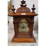 19th Century walnut manel clock, the gilded and silvered dial with Arabic numerals with a two