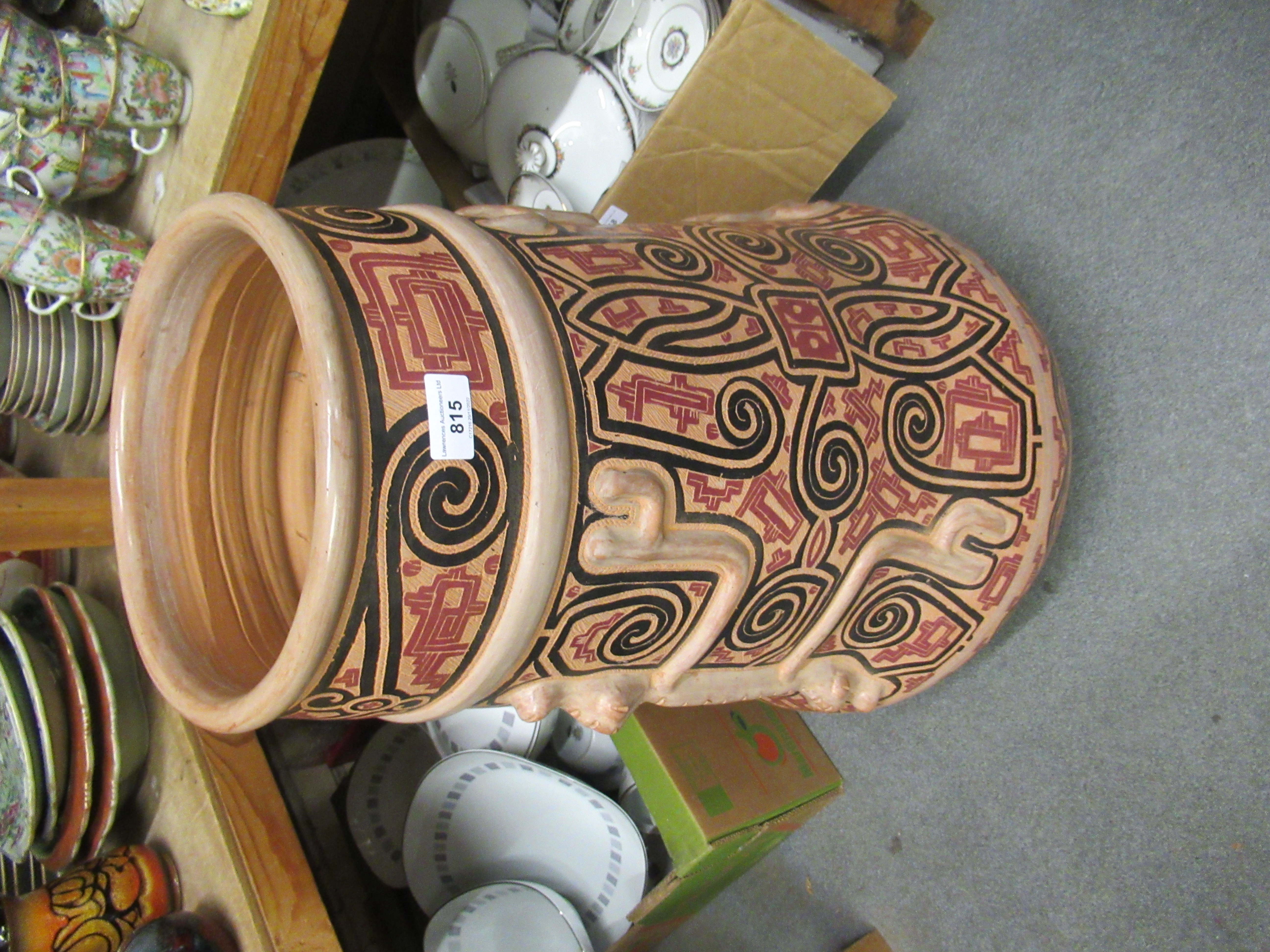 Large terracotta vase of South American ( Brazilian ) design, 29ins high Some minor loss to paint