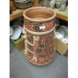 Large terracotta vase of South American ( Brazilian ) design, 29ins high Some minor loss to paint