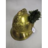 Early 20th Century French brass helmet inscribed ' Pompiers De La Marine ' with green feather plume