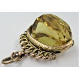 Late 19th / early 20th Century yellow metal mounted and facet cut citrine swivel fob