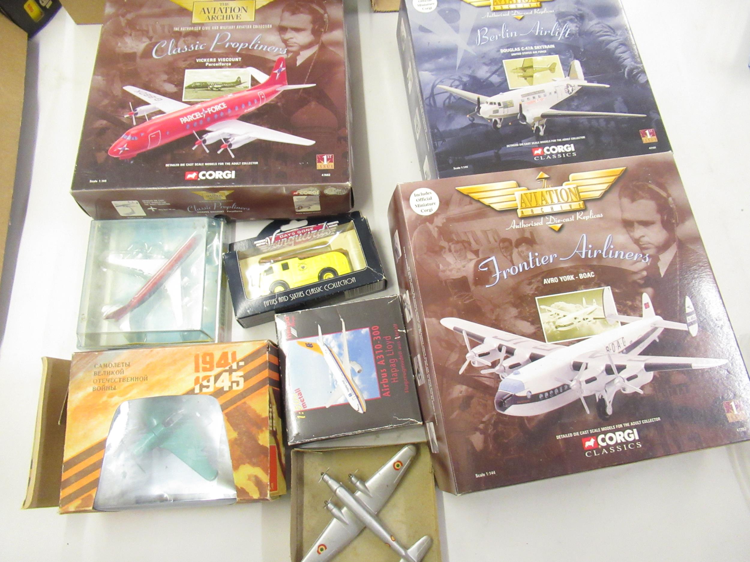 Three boxed Corgi diecast metal model aircraft together with a quantity of other boxed diecast metal