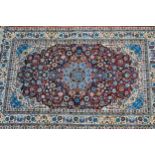 Modern Qum style rug with a lobed medallion and all-over palmette design on a deep red ground,