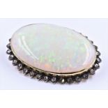 Very large opal and rose cut diamond brooch, the oval opal approximately 38mm x 25mm