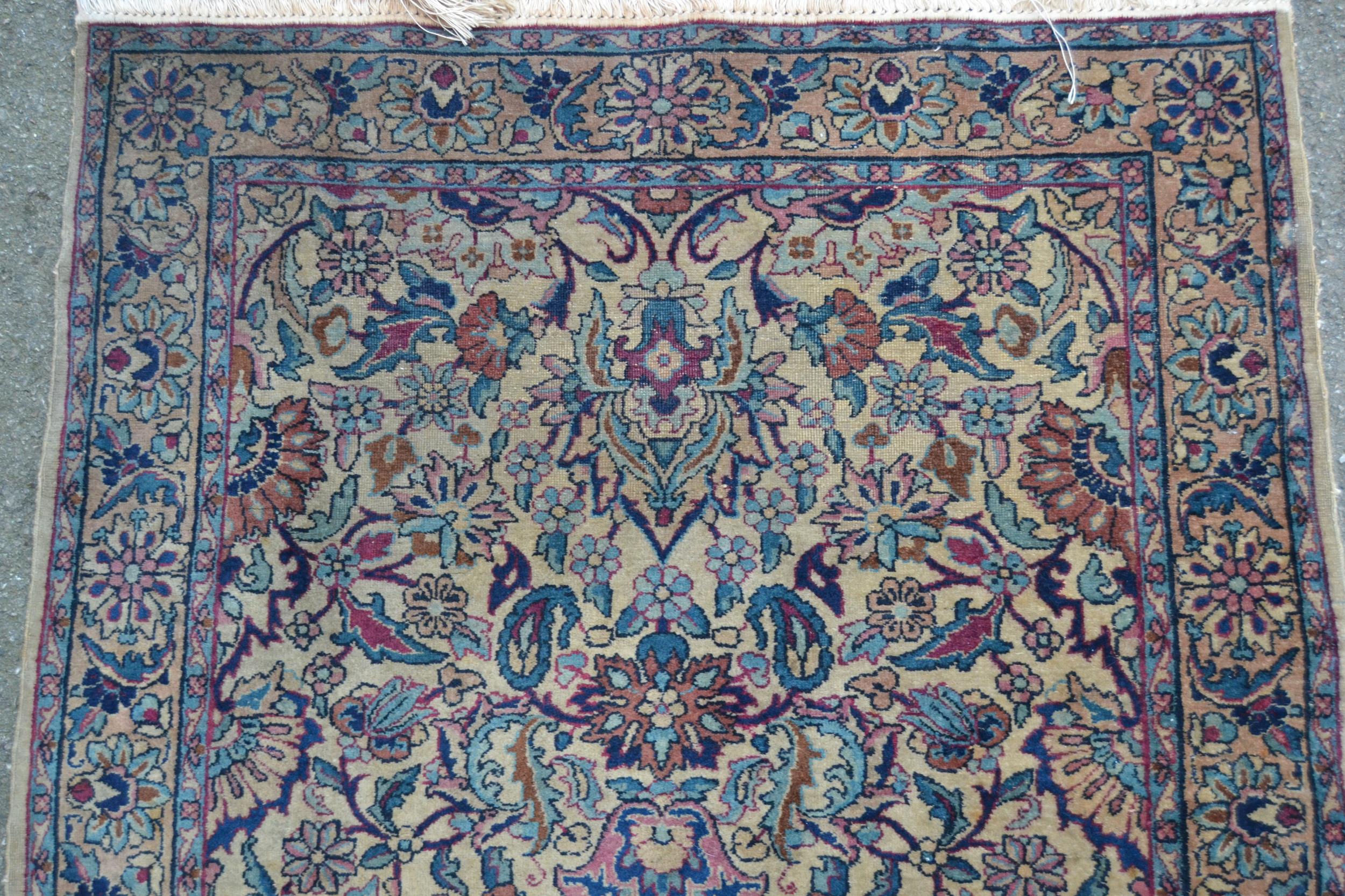 Small Indo Persian rug with an all-over floral design on a ivory ground with borders, 5ft 5ins x 2ft - Image 2 of 4