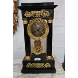 19th Century French ebonised and gilt metal mounted portico clock, having circular engine turned