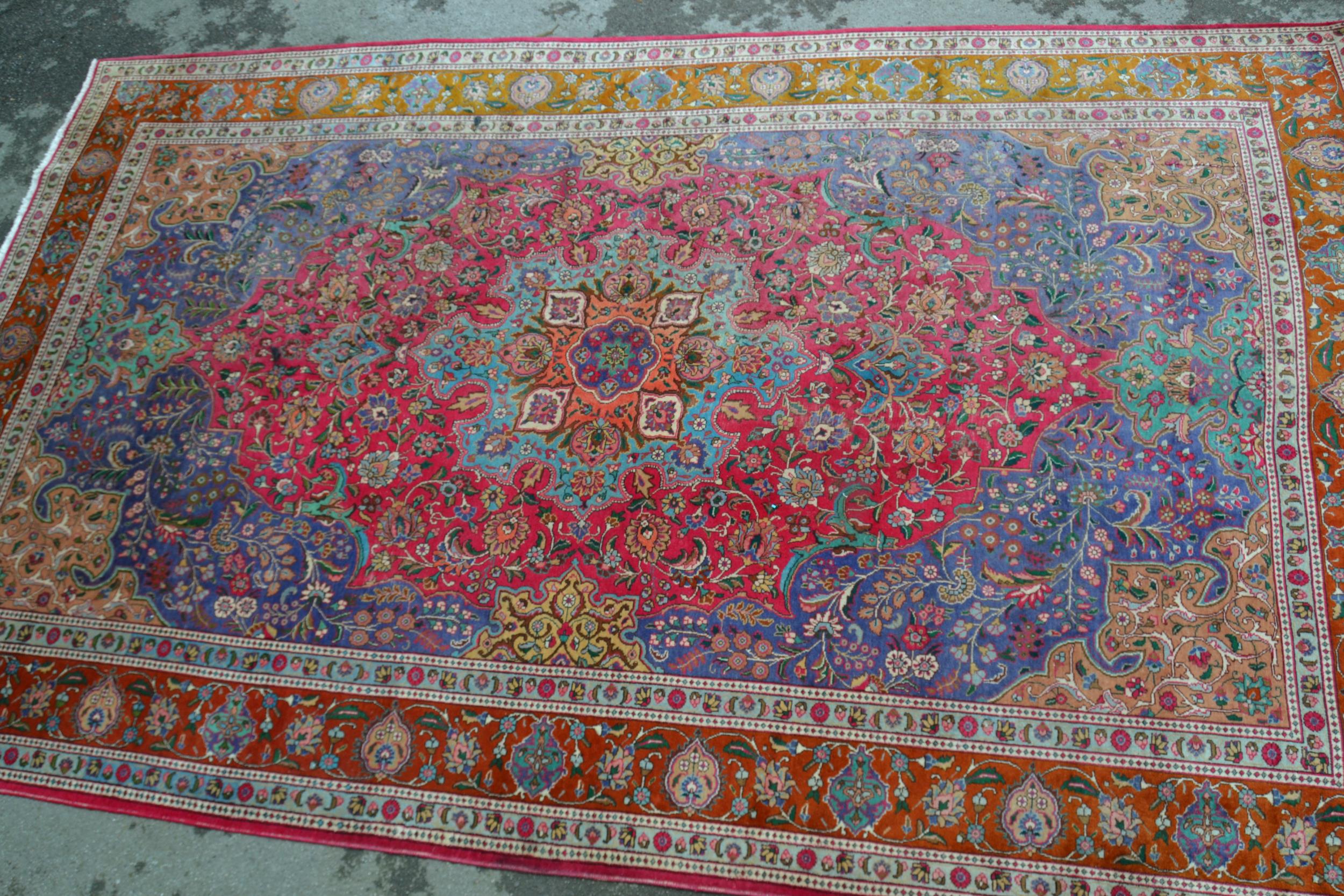 Large Tabriz carpet with a medallion and all-over polychrome floral design, 16ft x 10ft