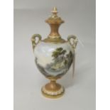 Royal Worcester two handled pedestal vase and cover, painted with a castle in a landscape, by G.