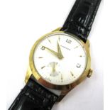 Gentleman's 9ct gold cased wristwatch by Garrards, the silvered dial with Arabic and baton numerals,