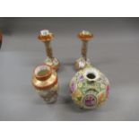 Pair of Japanese kutani porcelain candlesticks, decorated with panels of figures, 7ins high (with