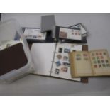 Box containing a collection of various World stamps and albums, including First Day covers