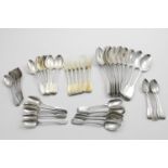ASSORTED ANTIQUE FIDDLE PATTERN FLATWARE:- Nine table spoons, six dessert spoons, six silvergilt