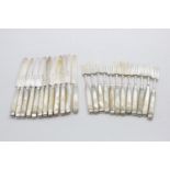 A SET OF TWELVE PAIRS OF GEORGE III MOTHER OF PEARL-HANDLED DESSERT/FRUIT KNIVES AND FORKS the tines