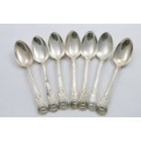 A SET OF SEVEN GEORGE III KING'S PATTERN TABLE SPOONS (Union Shell heel), each engraved with a crest