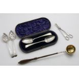 A MIXED LOT:- A cased pair of George III table spoons with engraved decoration, a pair of George III