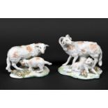 PAIR OF DERBY PORCELAIN SHEEP & LAMBS including one figure of a sheep with a suckling lamb, and a