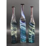 MDINA GLASS BOTTLE VASES three large bottle shaped vases, each with slender necks and square