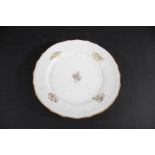 SWANSEA PORCELAIN DISH a moulded dish with sprigs of gilded flowers to the centre and border, the