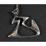 GEORG JENSEN SILVER PENDANT Model No 125, of abstract form and designed by Henning Koppel for
