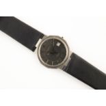 A GENTLEMAN'S STAINLESS STEEL WRISTWATCH BY BAUME & MERCIER the signed circular black dial with