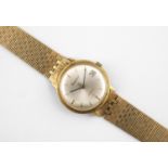 A GENTLEMAN'S 18CT GOLD WRISTWATCH BY BUECHE-GIROD the signed circular dial with baton numerals