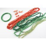 A QUANTITY OF ASSORTED JADE, CORAL AND MALACHITE BEADS a jade bangle, coral earrings and a coral