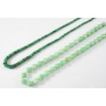 A SINGLE ROW UNIFORM JADE BEAD NECKLACE the jade beads measure approximately 9.5mm., with crystal