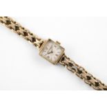 A LADY'S 9CT GOLD WRISTWATCH BY JAEGER-LeCOULTRE the signed square-shaped dial with Arabic
