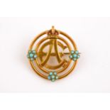 A GOLD, TURQUOISE AND ENAMEL ROYAL PRESENTATION BROOCH formed with the joint cypher for King